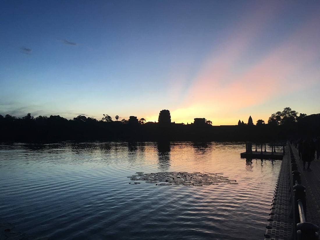Angkor Wat sunrise Cambodia eco-tourism heritage — book Siem Reap eco-stays via IMPT